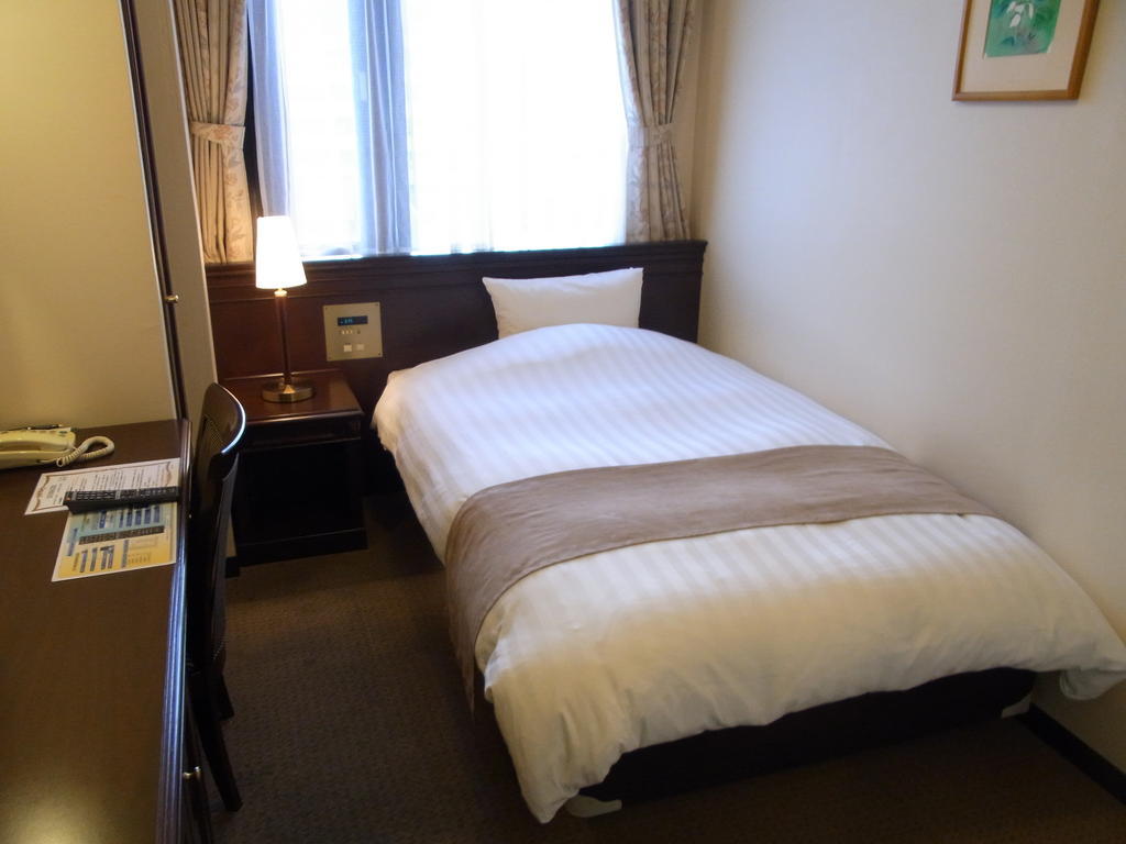 Amami Sunplaza Hotel Room photo